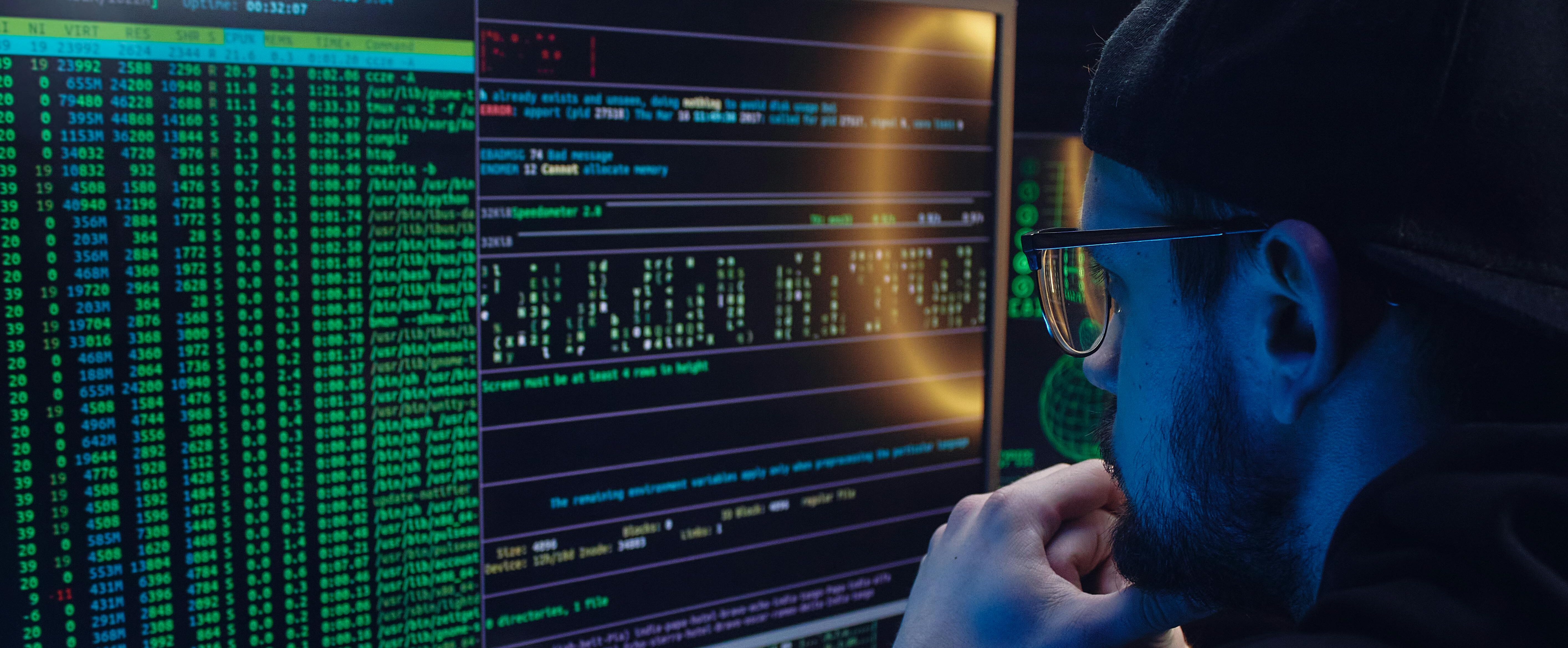 Cybersecurity engineer working on a secure network system in a modern office environment